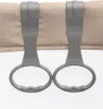Close-up of two gray handles attached to a tan fabric, with a white mesh material below. Produktbild-Vorschau