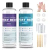 Two bottles of epoxy resin, along with various accessories for mixing and application, are displayed against a white background. Voir les images du produit
