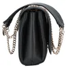 A side view of a black Guess crossbody handbag with a gold chain strap. Produktbild-Vorschau