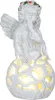 A white angel figurine sitting on a decorative orb, with internal lighting. Produktbild-Vorschau