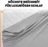 A close-up of a gray fitted sheet draped over a white quilted mattress. Produktbild-Vorschau