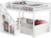 A white bunk bed with stairs and storage, featuring a daybed below and a loft bed above. It is styled with pillows and blankets.