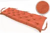 A tufted bench cushion in orange, shown on a white background with a close-up inset of the fabric texture. Produktbild-Vorschau