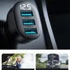 A car charger with three USB ports and a digital display, shown in a car's interior. Below are two smaller images showing people with car trouble. Anteprima dell’immagine prodotto