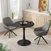 A dining table and chairs set in a well-lit room with a window and a cabinet in the background. Anteprima dell’immagine prodotto