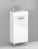 A white bathroom vanity with a sink and faucet against a gray wall. Anteprima dell’immagine prodotto