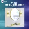 A bathroom vanity with a round mirror, two wall sconces, and faucets. Produktbild-Vorschau