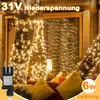 A string of warm white LED lights wrapped around tree trunks and a window, with a power adapter in the foreground. Anteprima dell’immagine prodotto