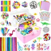 A collection of various craft supplies arranged around a pink craft box. Produktbild-Vorschau