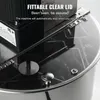 A close-up view of the top of an electric honey extractor, focusing on the clear lid and safety features. Náhled obrázku produktu