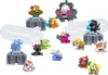 A collection of small monster-like figures arranged on a white background. Voir les images du produit