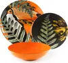 A set of dishes with a tropical bird and fern pattern, including plates and a bowl. Anteprima dell’immagine prodotto