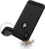 A black phone case is shown at an angle, appearing to be dropped onto a cracked surface, illustrating its protective qualities. Produktbild-Vorschau