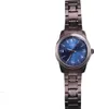 A close-up shot of a men's wristwatch with a blue dial and a silver metal band, isolated on a white background. Náhľad obrázku produktu