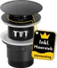 A black sink drain assembly with a yellow tag attached, showing product information. Produktbild-Vorschau