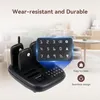 A restaurant pager system charging base with several pagers, set against a blurred background of a restaurant interior. Anteprima dell’immagine prodotto