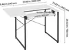 A white U-shaped sewing table with black metal legs, shown with dimensions indicated by text overlays. Produktbild-Vorschau