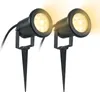 Two black LED garden lights with yellow light output, each mounted on a spike for ground insertion. Voir les images du produit