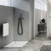 A modern bathroom with a shower tray, shower head, and a vanity. Produktbild-Vorschau