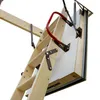 A close-up view of a wooden attic ladder, partially extended, against a white background. Produktbild-Vorschau