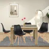 A dining table with four chairs in a well-lit room. Náhled obrázku produktu