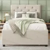 A bed with bedding and pillows in a bedroom setting. Anteprima dell’immagine prodotto