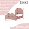 A diagram of a pink children's bed with dimensions and descriptive text in German. Voir les images du produit