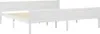 A white wooden bed frame with a slatted base, shown from a side angle against a white background. Náhľad obrázku produktu