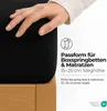A hand is shown pressing down on a black fitted sheet on a bed. Text overlays describe the product's features. Produktbild-Vorschau