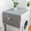 A cover is placed on top of a washing machine, with a plant on top of the cover. Podgląd zdjęcia produktu