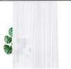 A white sheer curtain hangs on a rod, with a potted Monstera plant partially visible to the left. Produktbild-Vorschau
