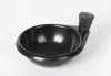 A black frying pan with a handle and an egg insert, photographed against a white background. Voir les images du produit