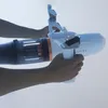 Hands holding a white and gray underwater scooter with orange accents. Podgląd zdjęcia produktu