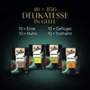 A promotional image for Sheba cat food, showing a variety pack of four different flavors in pouches, with text detailing the contents and quantities. Produktbild-Vorschau