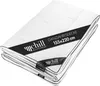 A folded white blanket with a black band displaying product information.