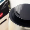 A close-up shot of the top of a humidifier, showing steam rising from it. Podgląd zdjęcia produktu