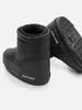 A pair of black Moon Boots shown from a low angle against a white background. Anteprima dell’immagine prodotto