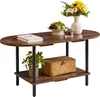 A dark brown oval coffee table with two shelves, decorated with a book, a fruit bowl, a vase with flowers, a small plant, and a woven basket. Náhled obrázku produktu
