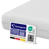 A close-up of a white mattress with a label showing product features and certifications. Produktbild-Vorschau