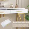 A close-up of a white console table with gold legs, showing an open drawer and decorative items on top. Overlay text highlights storage. Anteprima dell’immagine prodotto