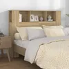 A bedroom scene with a bed and a headboard with shelves. Produktbild-Vorschau