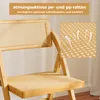 Close-up of a bamboo folding chair with rattan seating and backrest. Podgląd zdjęcia produktu