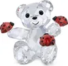 A clear, professional studio shot of a crystal teddy bear figurine with ladybugs. Voir les images du produit