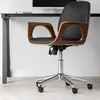 A black office chair with wooden accents sits next to a desk. Produktbild-Vorschau