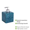 A blue ceramic soap dispenser with a decorative pattern and a chrome pump is shown against a white background. Náhled obrázku produktu