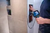 A person is using a Bosch inspection camera to inspect pipes behind a wall. Anteprima dell’immagine prodotto
