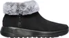 A black Skechers boot with gray faux fur trim is shown against a white background. Produktbild-Vorschau