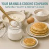 A baking scene with ingredients and finished pancakes, suggesting the use of baking soda. Produktbild-Vorschau