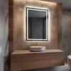 A modern bathroom vanity with a sink and a lighted mirror above it. The mirror has musical notes and sound waves depicted around it, suggesting it has a Bluetooth speaker feature. Podgląd zdjęcia produktu