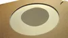 A close-up view of a cardboard dust bag with a circular window. Anteprima dell’immagine prodotto